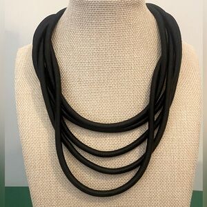 Corded necklace.